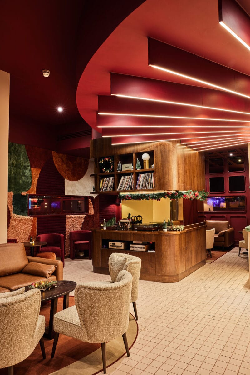 Modern lounge with cosy seating and warm lighting